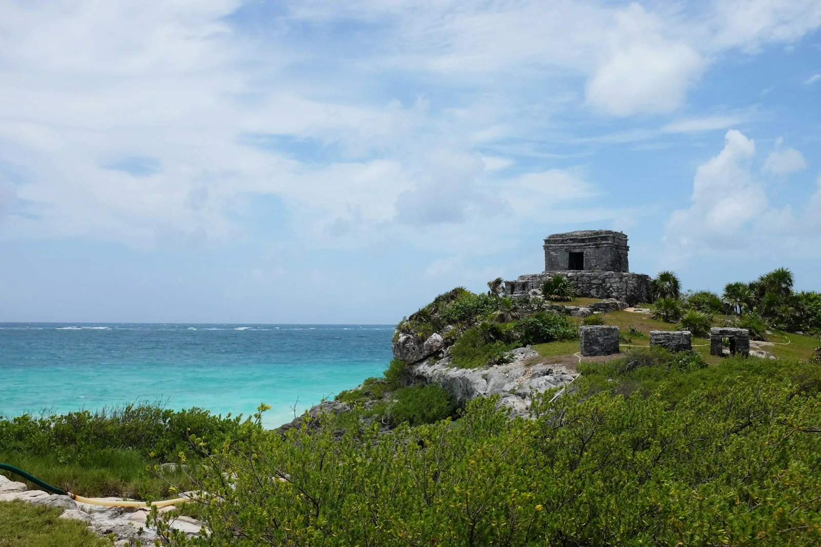 Tulum Mayan ruins on a cliff above turquoise Caribbean water, an easy day trip from Playa del Carmen
